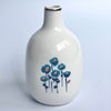 Poppies and Posies Ceramic Bud Vases with gold detailing by Misha Zadeh, featuring floral watercolor artwork. Blue Poppy Group Vase