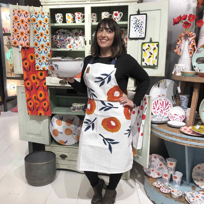 Misha Zadeh modeling her Inky Poppies Screen Printed Apron in the 180 Degrees Showroom in Atlanta