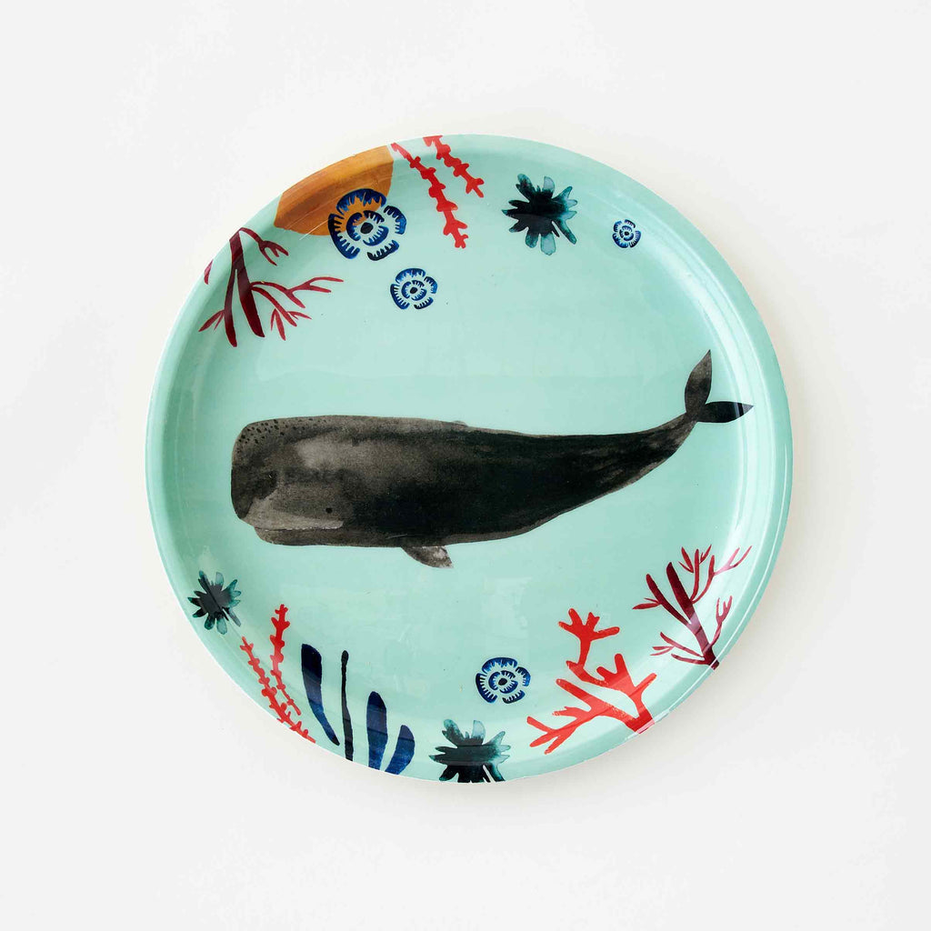 Misha Zadeh Whale Tray for 180 Degrees. Gray whale, red and blue coral and seaweed bring lush pops of color against a vibrant sea green background