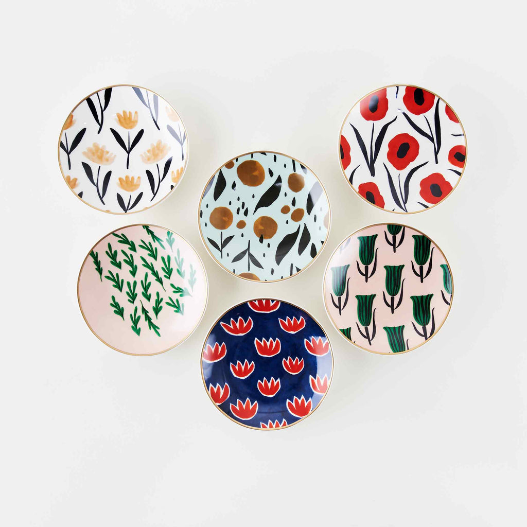 Six colorful ceramic trinket dishes with gold detailing