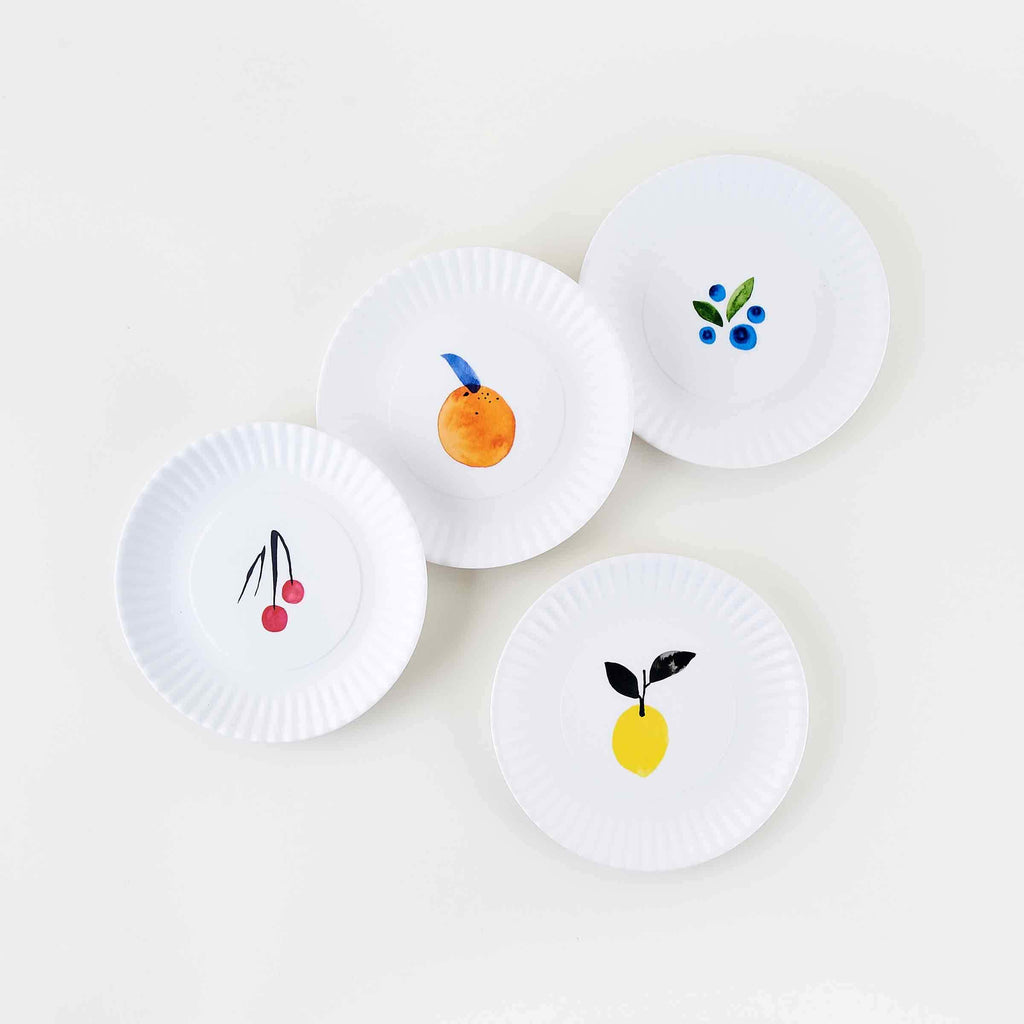 MIsha Zadeh Fantastical Fruit Melamine Plates with Crimped Edges. Oranges, Lemons, Cherries, and Blueberries patterns. 7 1/2 inch luncheon size.