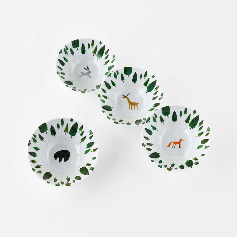 Misha Zadeh Winter Forest melamine snack bowls featuring a Black Bear, Tawny Deer, Red Fox, and Gray Hare or Rabbit in a green forest with snowy white background