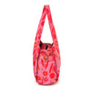 Misha Zadeh Poppy Tulip Power Handbag in pink with orange and tan tulips and poppies on it