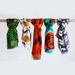 Misha Zadeh Modal Scarves including Fern Forest, Rain Garden in White and Tomato, Teal Red Rose, and Geometric Swans